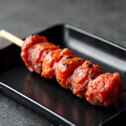 Close-up of perfectly grilled authentic Armenian Lula Kebabs, showcasing their rich texture and golden-brown finish. Prepared on a traditional Mangal grill, emphasizing their local appeal in Sacramento.