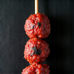 Expertly Grilled Lula Kebab. Perfectly seasoned ground meat skewers cooked over a live charcoal mangal grill, served with traditional Armenian sides.