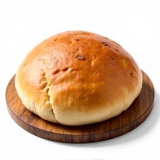 Traditional Svanetian Kubdari, Georgian Meat Bread, served on a rustic wooden board.